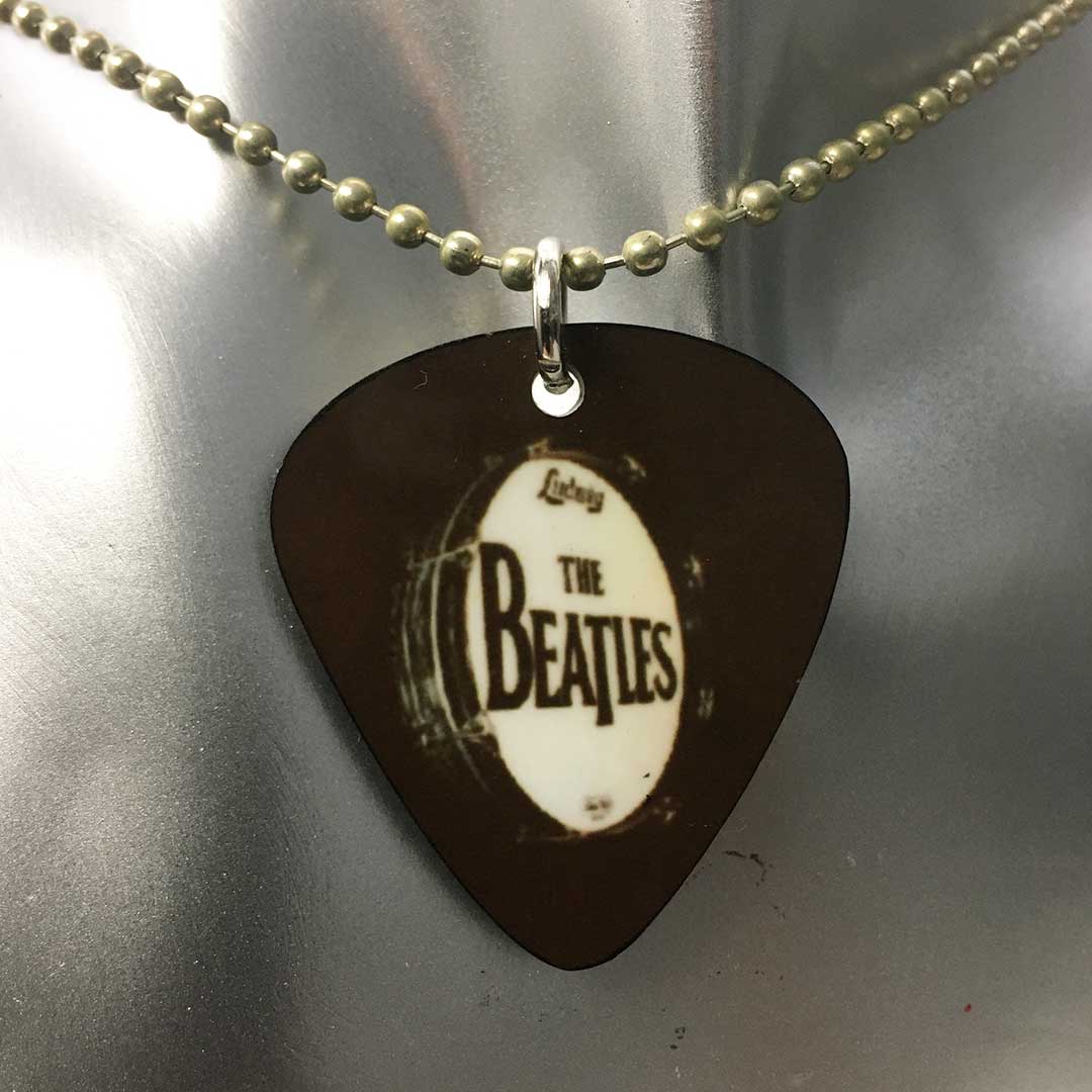 Collana con ciondolo a forma di plettro Beatles - batteria